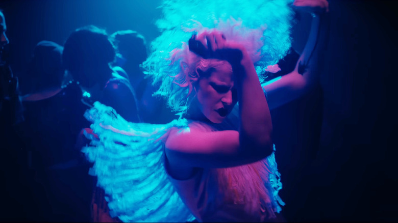 Jessie Buckley as The Bride dancing in a nightclub in The Bride!