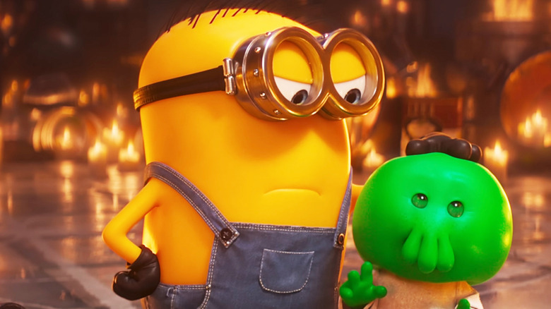 A minion stands next to Goomi in Minions & Monsters