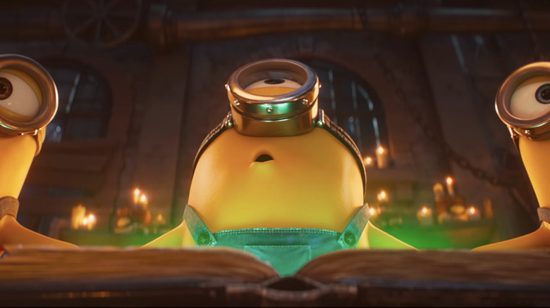 Minions gather round a green glowing book in Minions & Monsters