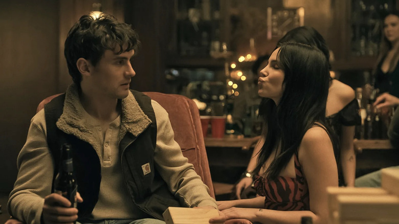 Michael Johnston as Bear looking alarmed as Inde Navarrette as Nikki tries to kiss him in Obsession