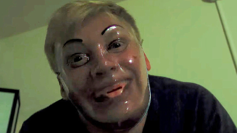 Milk wearing a creepy plastic mask in Milk & Serial