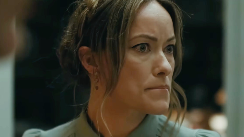 Olivia Wilde as Angela looking panicked in The Invite