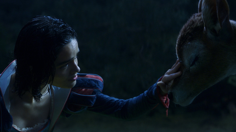 Rachel Zegler as Snow White petting a deer in Snow White (2025)