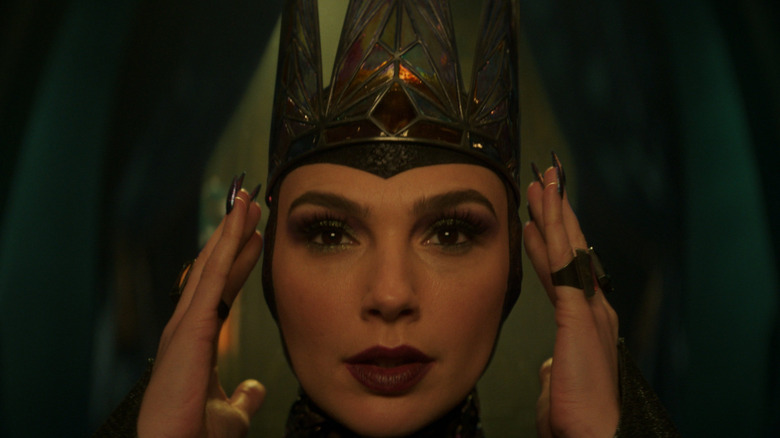 Gal Gadot as the Evil Queen adjusting her crown in Snow White (2025)