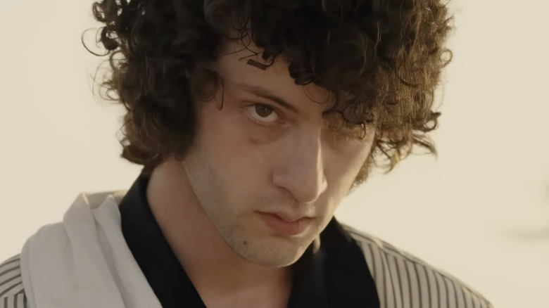 Dominic Sessa as Anthony Bourdain with his hair mussed up in Tony