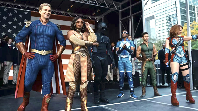 The Boys, Homelander, Sister Sage, Black Noir, A-Train, the Deep, and Firecracker on stage together