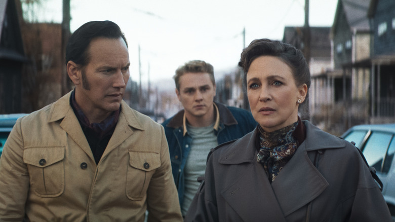 Lorraine and Ed Warren walking down a street in The Conjuring: Last Rites