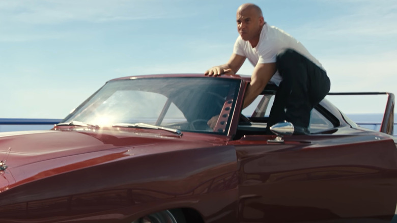 Vin Diesel as Dom climbing out of a car in Fast and Furious 6