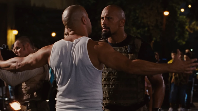 Vin Diesel and Dwayne Johnson as Dom and Hobbs facing off in Fast Five