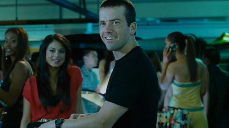 Lucas Black as Sean smiling in a crowd in The Fast and the Furious: Tokyo Drift