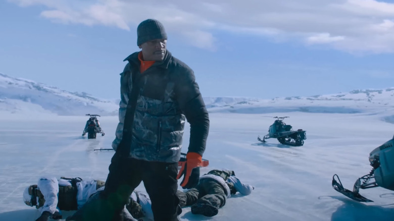 Tyrese Gibson as Roman, in a snowy tundra surrounded by wreckage, in The Fate of the Furious