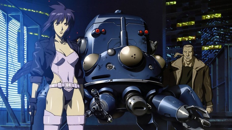 Major Kusanagi stands next to a big robot in Ghost in the Shell: Stand Alone Complex