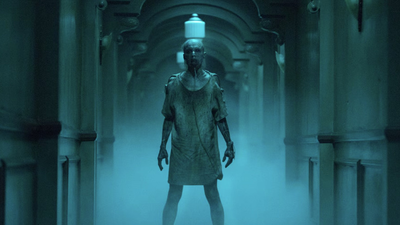 The demon known as the Man Who Can't Breathe stalks the halls of a hospital in Insidious: Chapter 3
