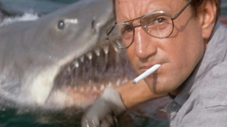 The shark popping out of the water behind Chief Martin Brody in Jaws