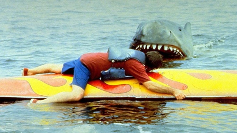 A man facing off against the shark in Jaws 2