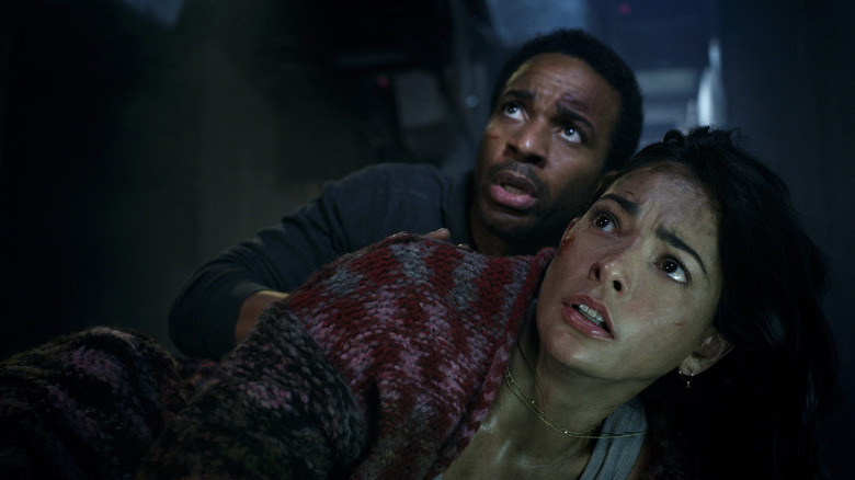 Dennis and Marianna, bruised and scared, on the floor in Battle at Big Rock