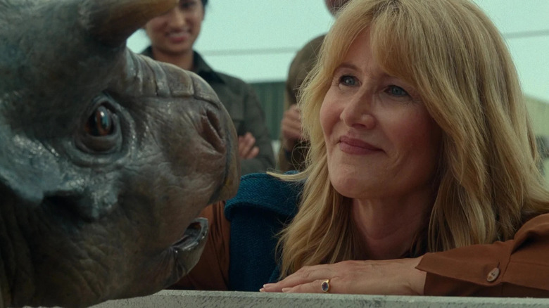 Dr. Ellie Sadler looking at a baby dinosaur in Jurassic World Dominion