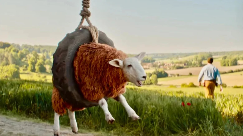 A sheep enjoys his tire swing while George hikes off in The Sheep Detectives