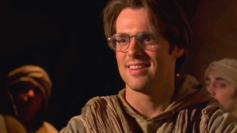 Michael Shanks as Daniel Jackson standing among Abydonians on Stargate SG-1