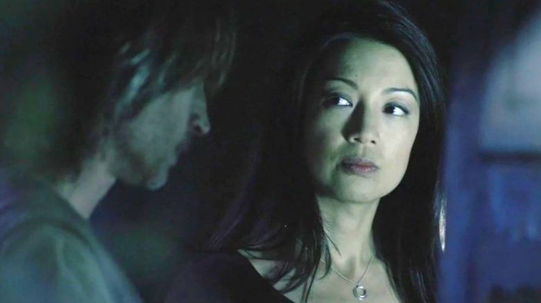 Ming-Na Wen as Camille Wray looking at Robert Carlyle as Nicholas Rush on Stargate Universe
