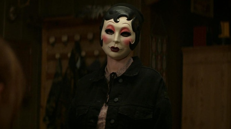 Pin-Up Girl in a cabin in The Strangers: Chapter 1