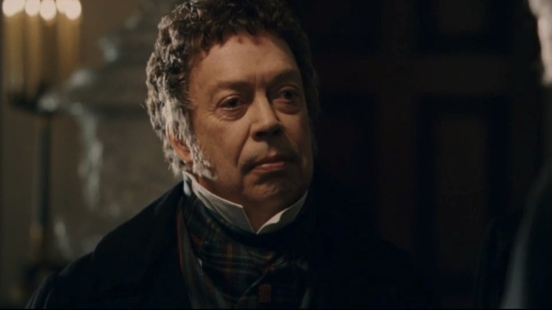 Tim Curry's Alexander Monro is seen in shadow in Burke & Hare