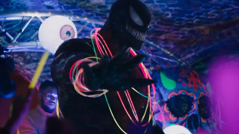 Venom drops the mic during a queer rave in Venom: Let There Be Carnage