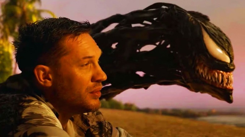 Eddie and Venom sit by the beach and watch the sunset together in Venom: The Last Dance