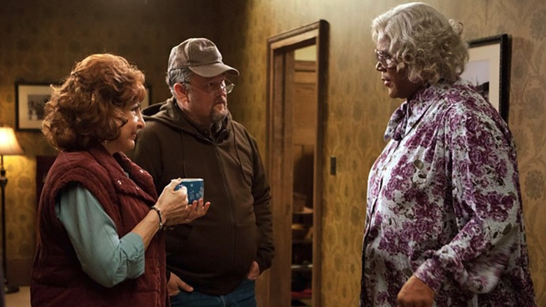 Madea Simmons (Tyler Perry) talks with Buddy Williams (Larry the Cable Guy) and Kim Williams (Kathy Najimy) over drinks in A Madea Christmas
