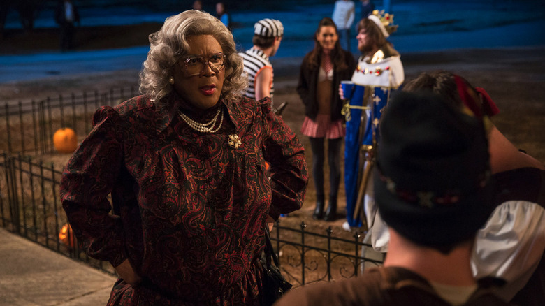 Madea Simmons (Tyler Perry) lectures costumed frat boys in a yard in Boo! A Madea Halloween