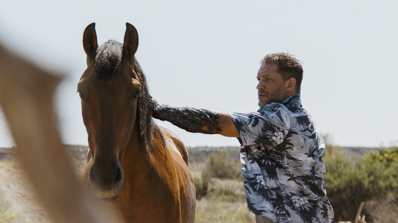 Tom Hardy as Eddie Brock/Venom infecting a horse in Venom: The Last Dance