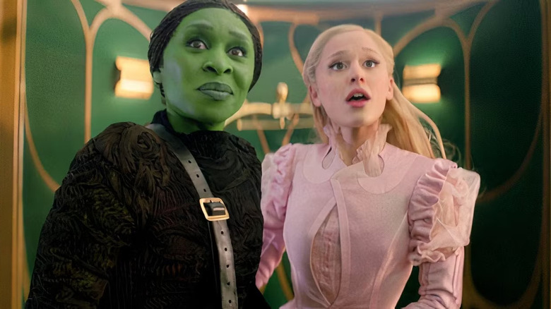 Cynthia Erivo as Elphaba and Ariana Grande as Glinda looking amazed in Wicked