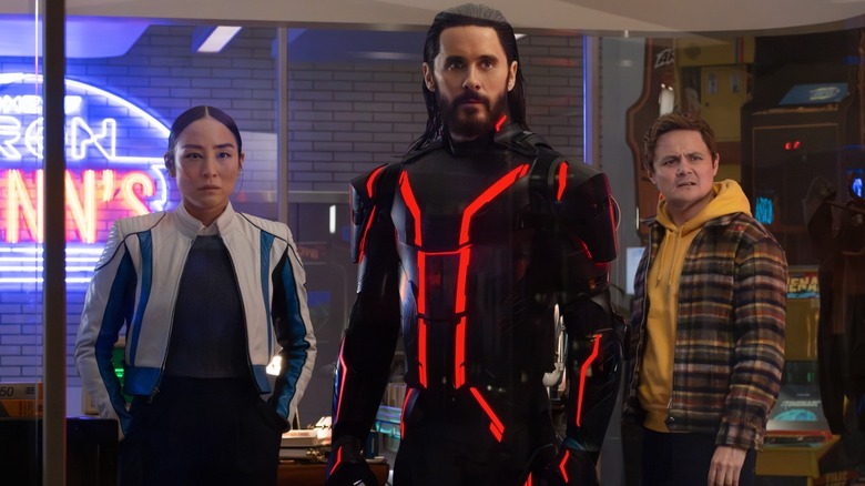 Eve Kim, Ares and Seth stood in Flynn's office in Tron: Ares