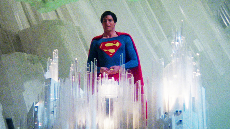 Chrstopher Reeve as Superman stands in front of crystals in the Fortress of Solitude in Superman