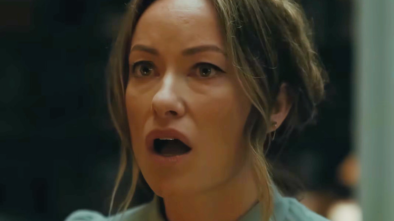 Olivia Wilde as Angela looking panicked in The Invite
