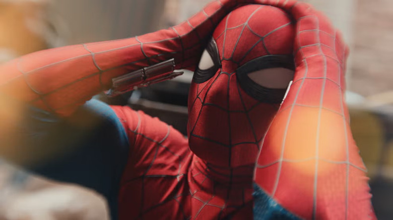 Spider-Man holds his head in pain in Spider-Man: Brand New Day