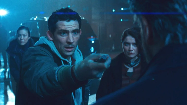 Daniel, with Eve next to him, holds out the device to Noah in Disclosure Day