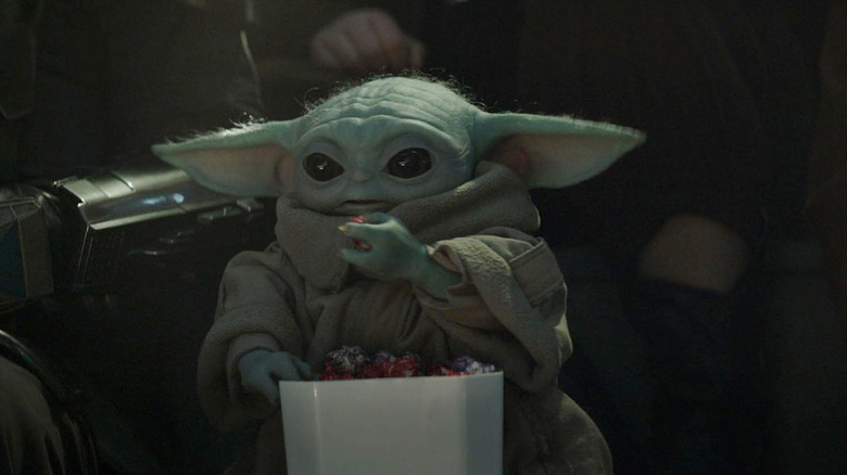 Grogu eating a bunch of snacks in The Mandalorian and Grogu