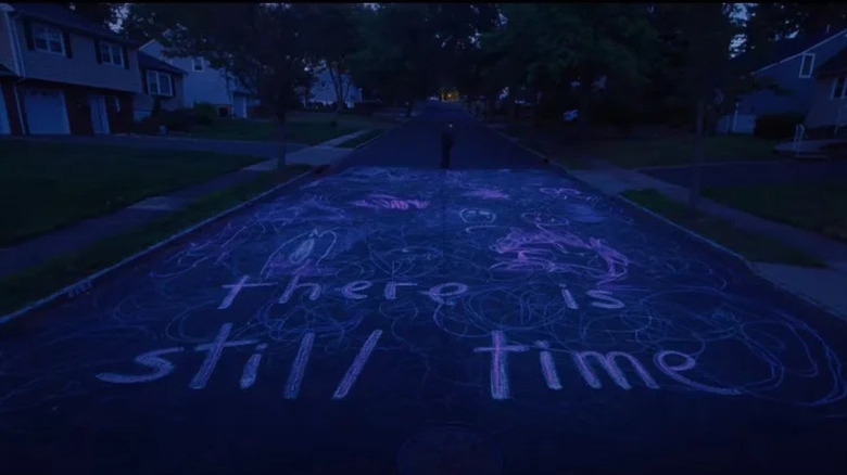 Writing is seen on the street in I Saw the TV Glow.webp