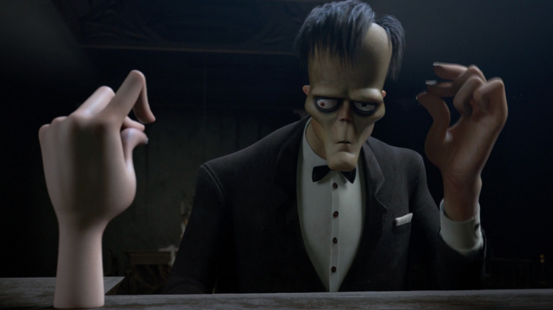 Thing and Lurch in The Addams Family