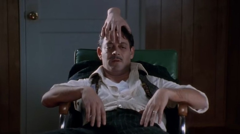 Thing and Gomez in The Addams Family