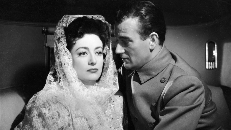 Joan Crawford and John Wayne in Reunion in France