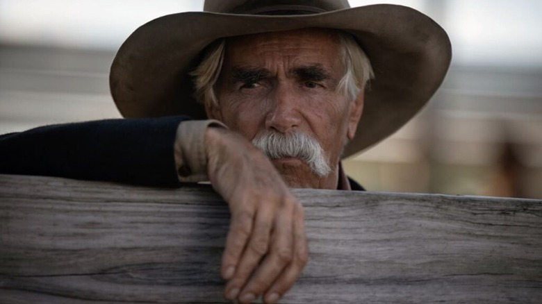 Sam Elliott Shea Brennan leaning against a fence in 1883