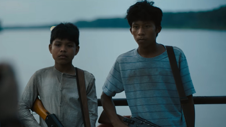 Two young boys with machine guns in The Last Photograph