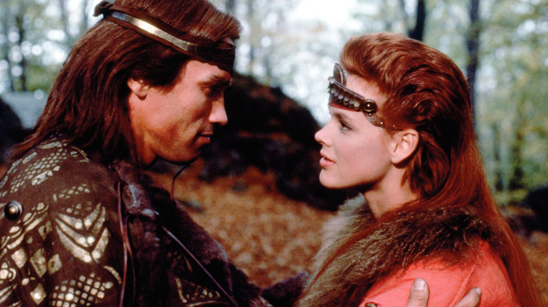 Red Sonja (Brigitte Nielsen) and Lord Kalidor (Arnold Schwarzenegger) gazing at each other in Red Sonja (1985)