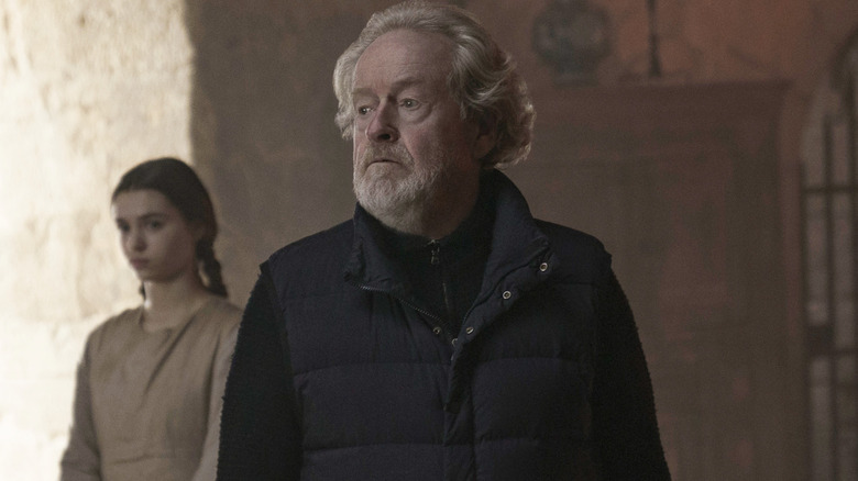 Ridley Scott filming a scene on the set of The Last Duel