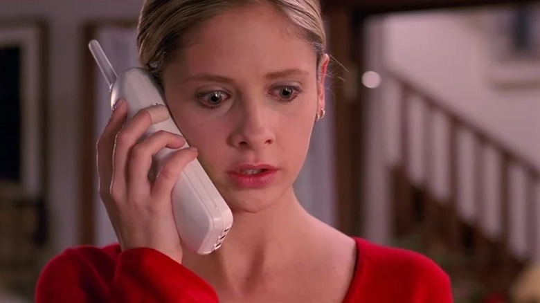 Buffy The Vampire Slayer - Buffy holding phone looking mortified