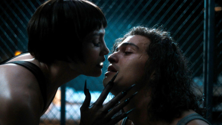The Spider Woman leans into Molina for a deadly kiss in Kiss of the Spider Woman