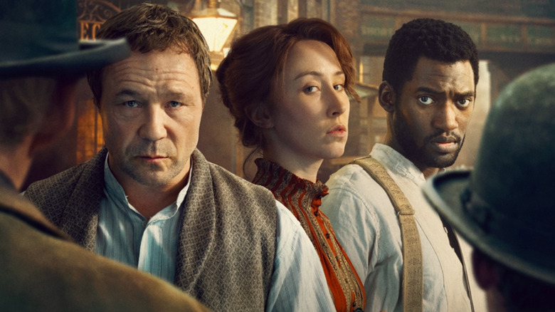 Stephen Graham as Sugar Goodson, Erin Doherty as Mary Carr, and Malachi Kirby as Hezekiah Moscow standing side by side in the poster for A Thousand Blows