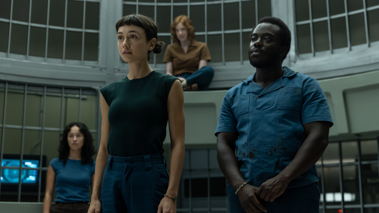 Wendy and the Lost Boys standing in a cage at Neverland in Alien: Earth